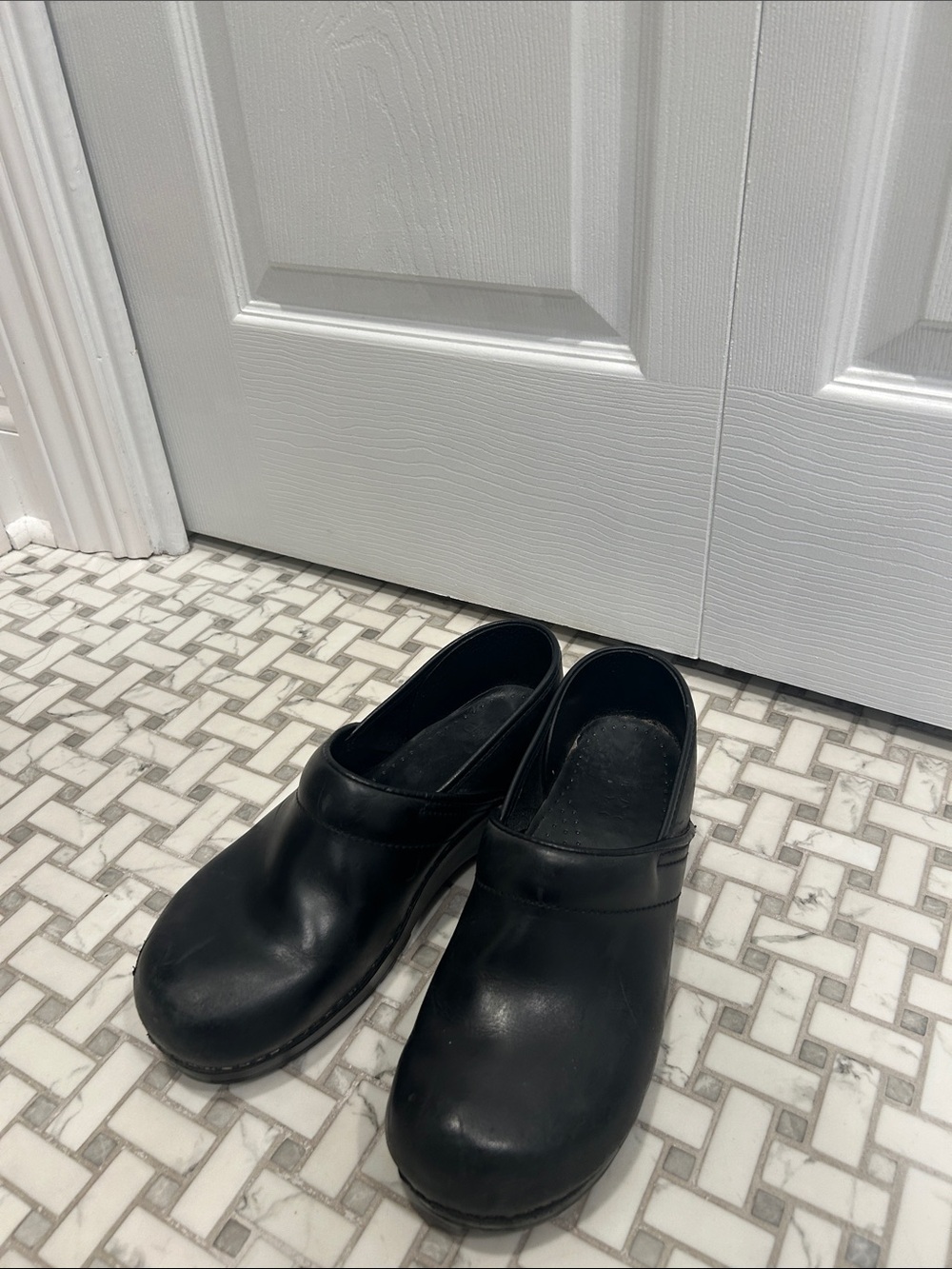 Women’s Black Slip-On Leather Dansko Clogs